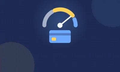 Illustration of a credit score gauge with its needle pointing high above a blue credit card.